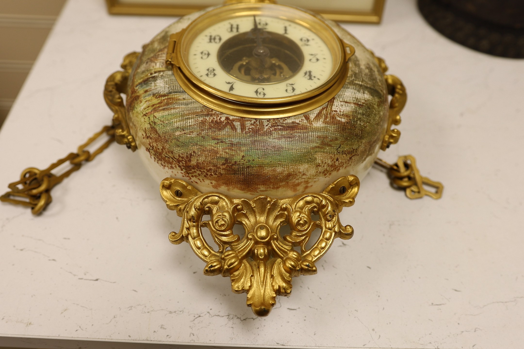 A late 19th century French ornate ceramic and gilt brass wall clock, 35cm tall